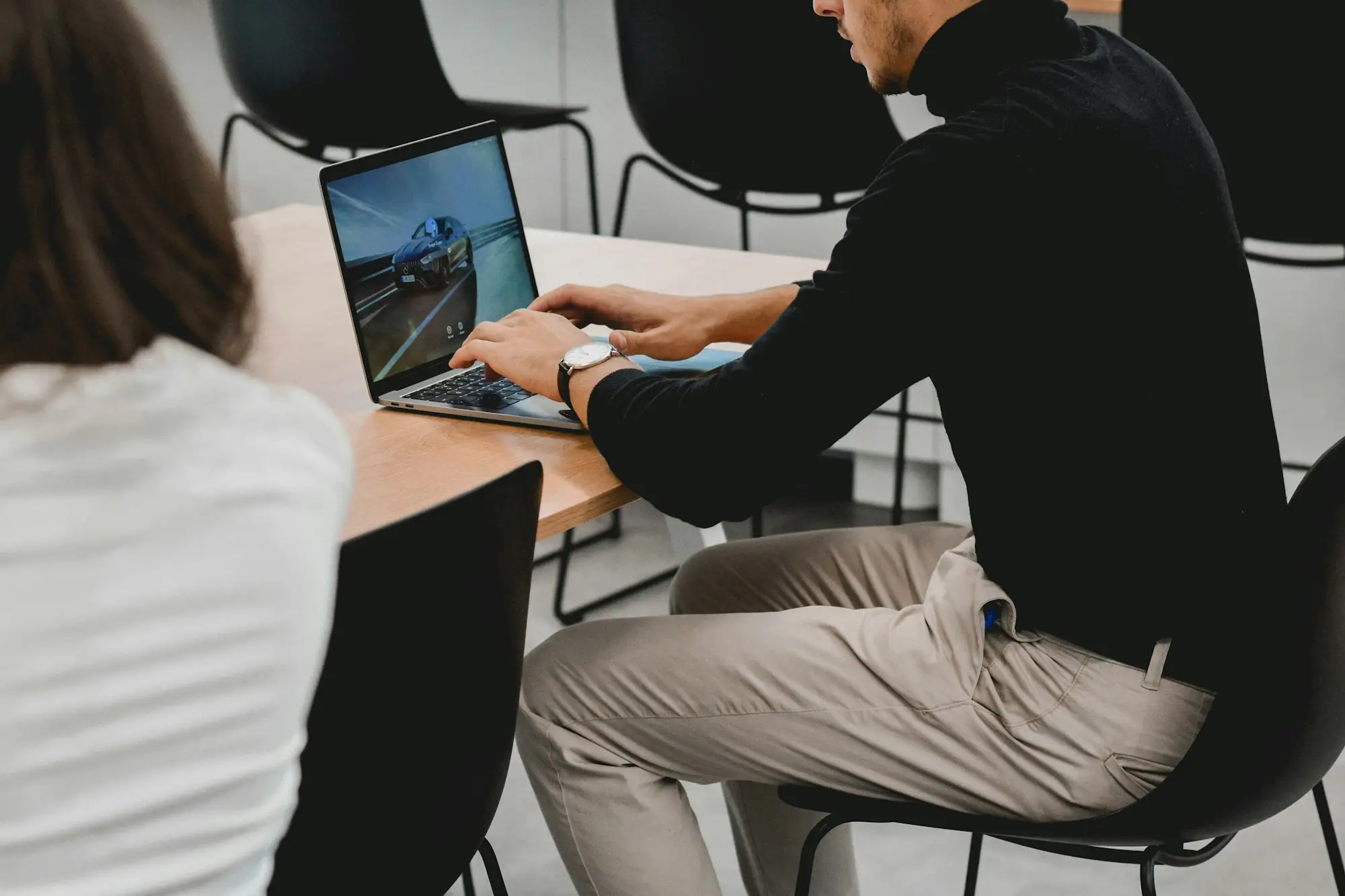 New team member being shown the ropes at a laptop in Melbourne