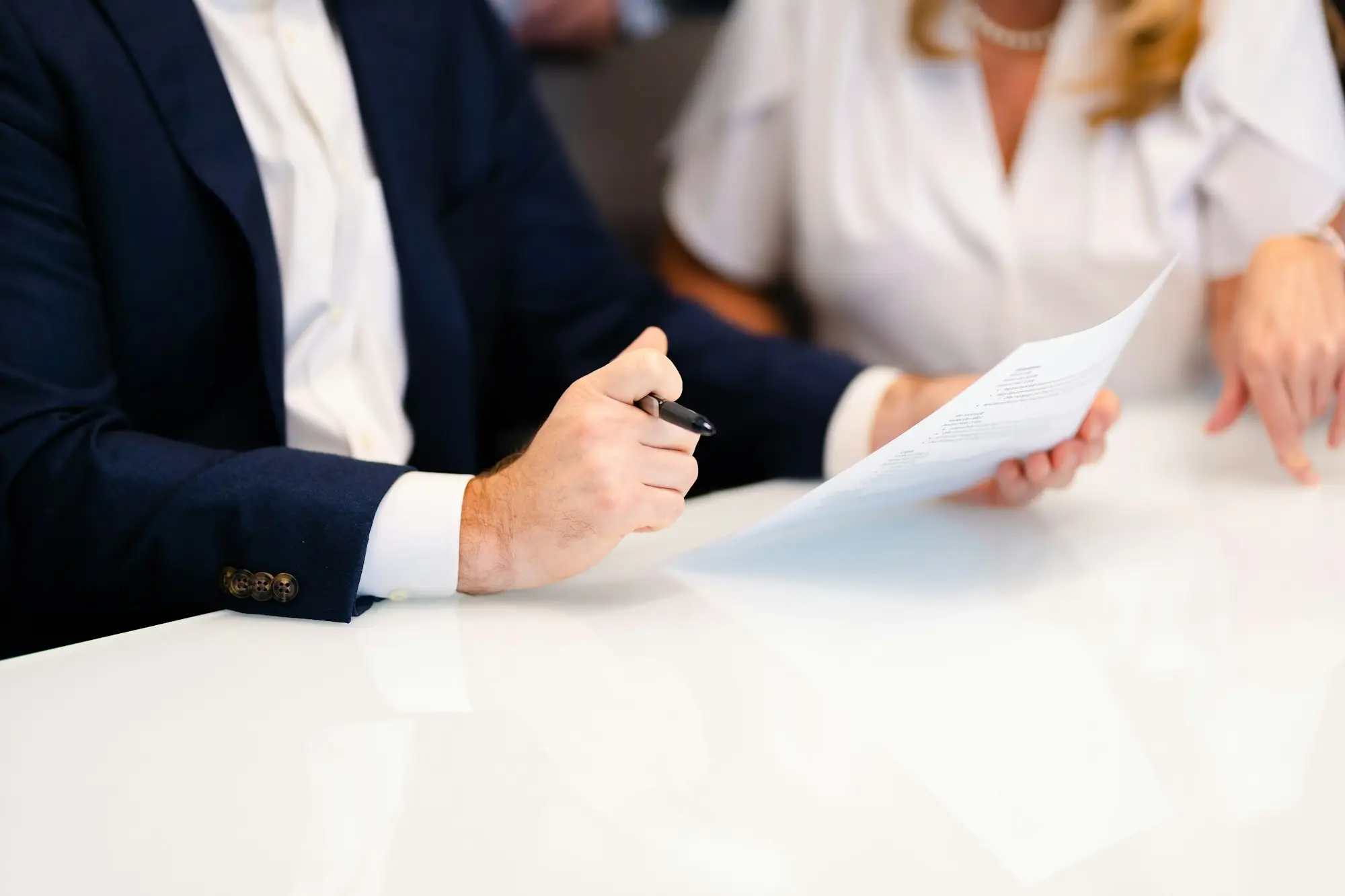 Accountant going through tax paperwork with a client
